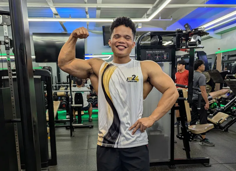 Modern Fit24 Gym Interior with Smiling gymmer